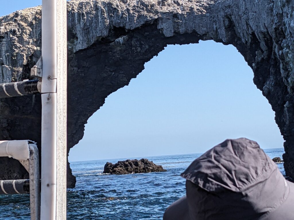 a large rock arch over the ocean at Anacapa Island.